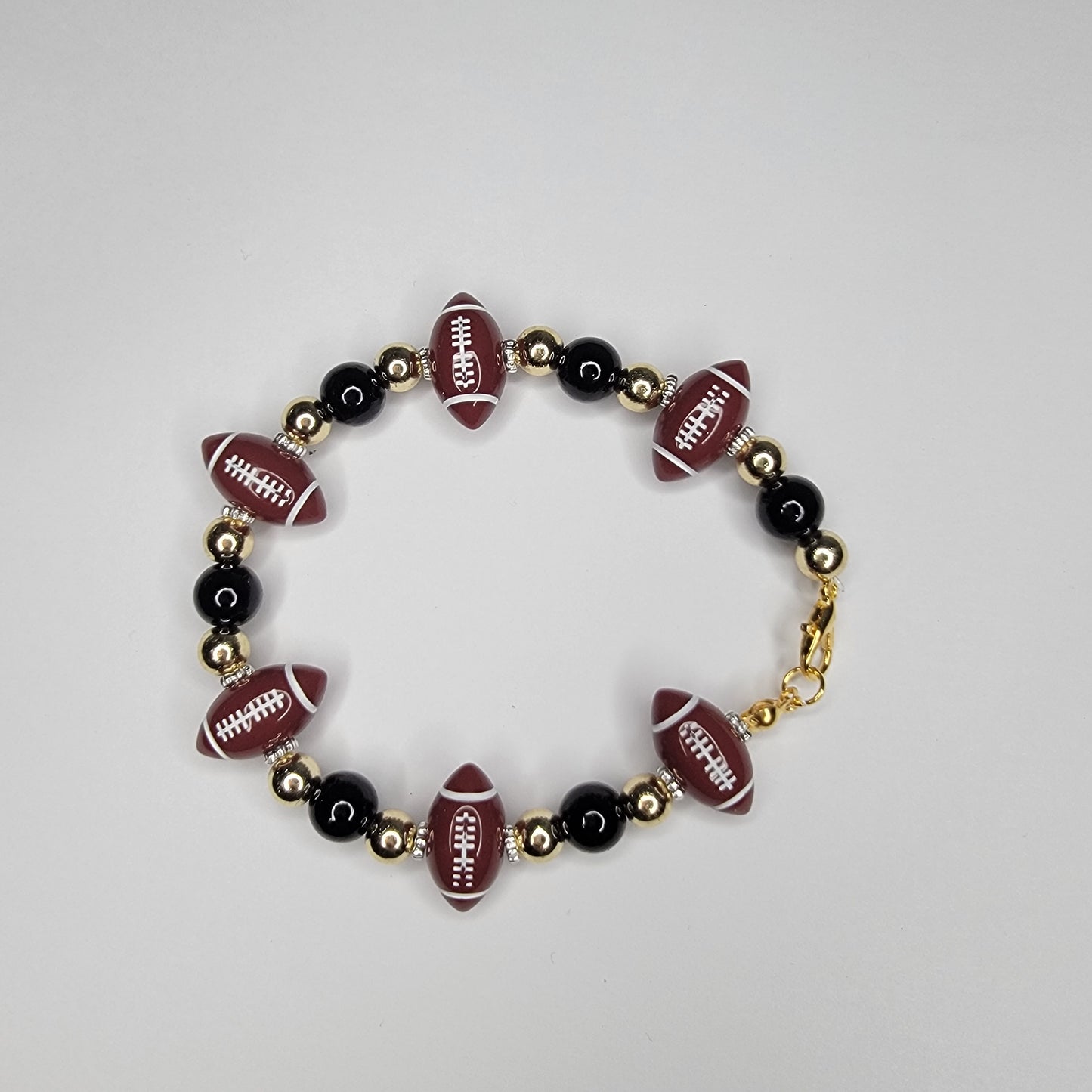 Handmade New Orleans Saints Football inspired black and gold bracelet